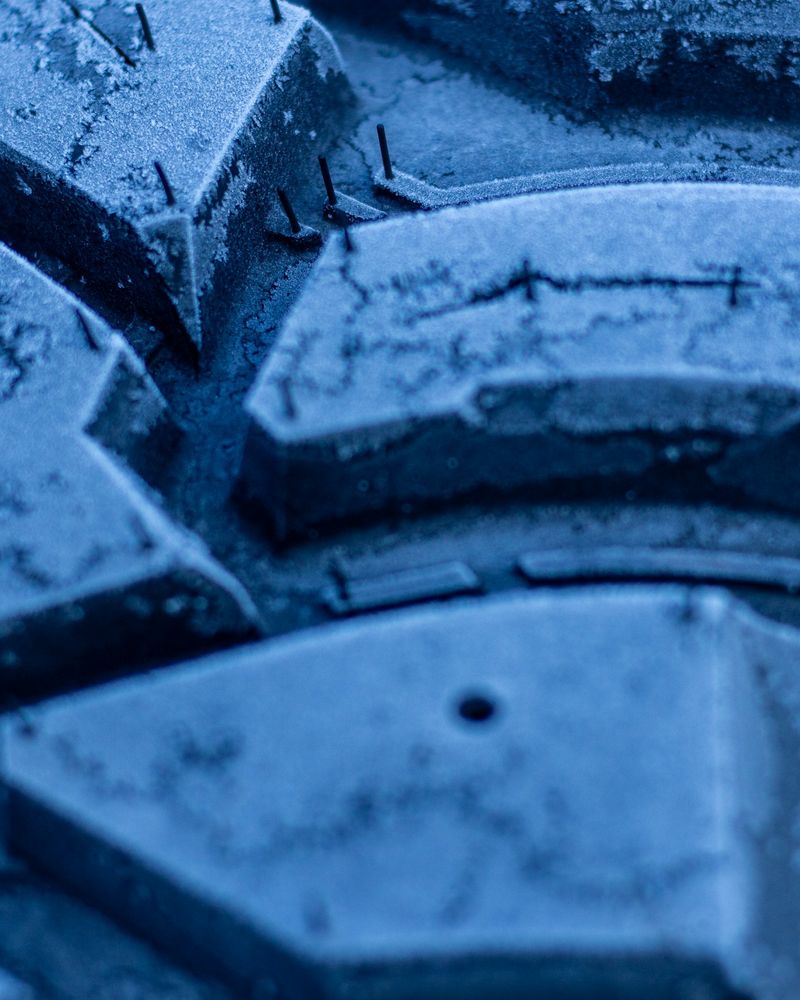 Close-up of tire tread covered in frost