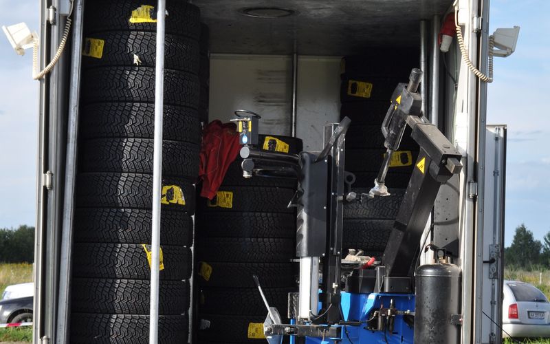 Mobile tire service van stocked with tires and a tire changer